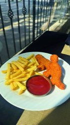 Chicken nuggets with fries and ketchup